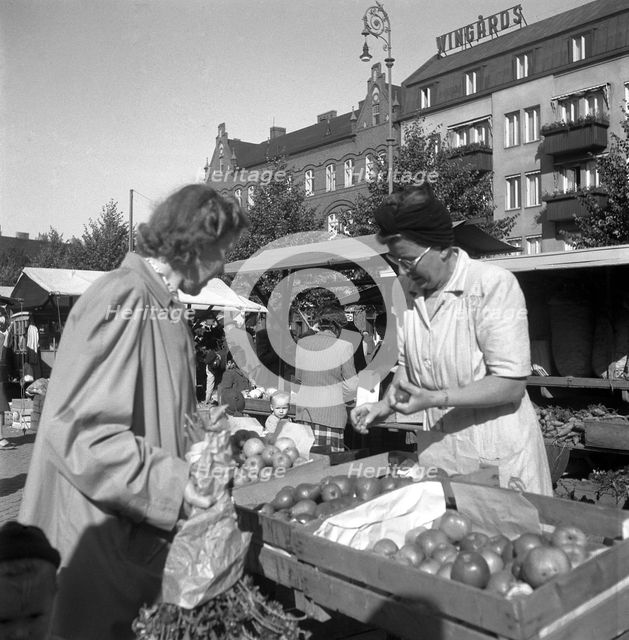 Fruit and vegetable stall in the market, Malmö, Sweden, 1947. Creator: Otto Ohm.
