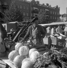 Fruit and vegetable stall in the market, Malmö, Sweden, 1947. Creator: Otto Ohm