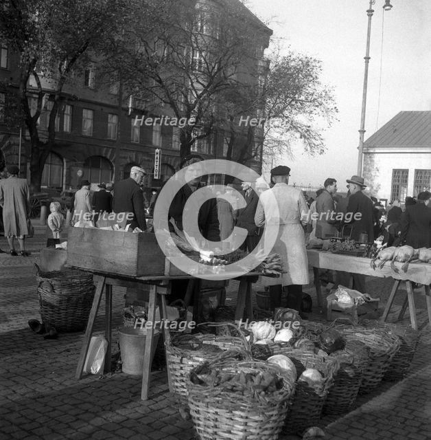 Fruit and vegetable stall in the market, Malmö, Sweden, 1947. Creator: Otto Ohm.