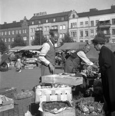 Fruit and vegetable stall in the market, Malmö, Sweden, 1947. Creator: Otto Ohm