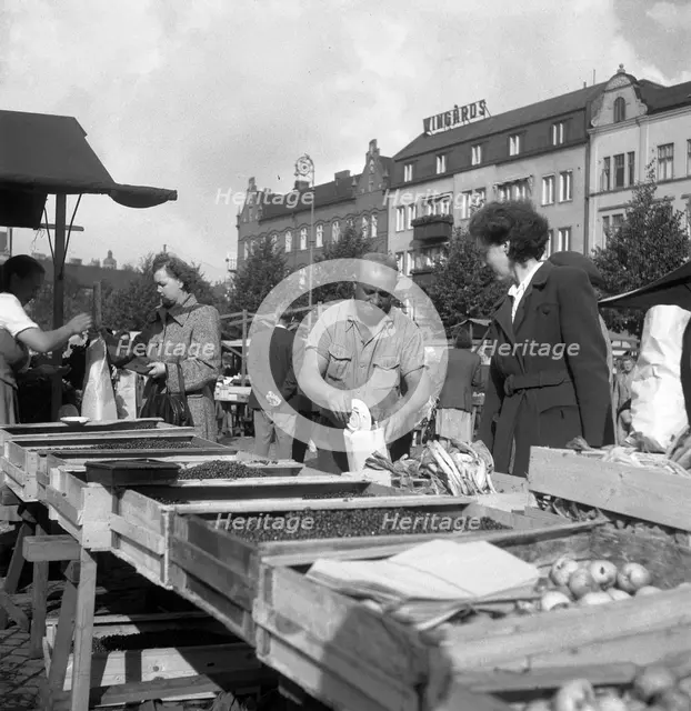 Fruit and vegetable stall in the market, Malmö, Sweden, 1947. Creator: Otto Ohm.