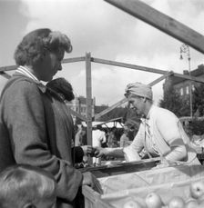 Fruit and vegetable stall in the market, Malmö, Sweden, 1947. Creator: Otto Ohm