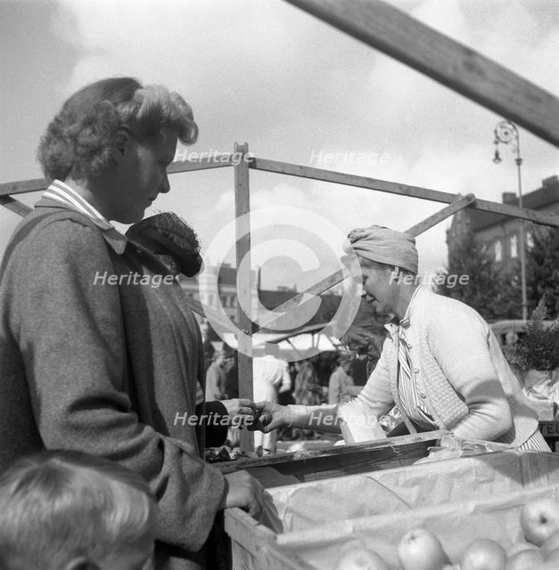 Fruit and vegetable stall in the market, Malmö, Sweden, 1947. Creator: Otto Ohm.