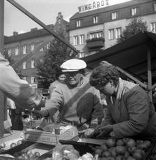 Fruit and vegetable stall in the market, Malmö, Sweden, 1947. Creator: Otto Ohm