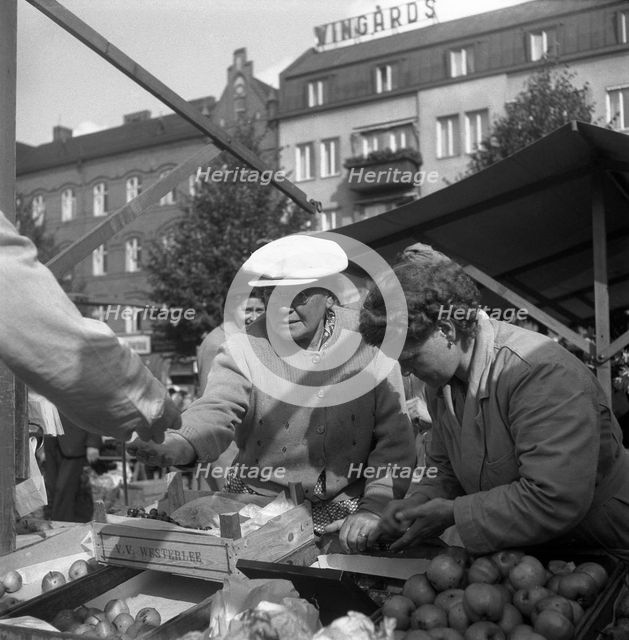 Fruit and vegetable stall in the market, Malmö, Sweden, 1947. Creator: Otto Ohm.