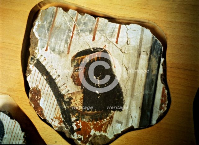 Fragment of a fresco from Thebes, showing a woman playing the harp.