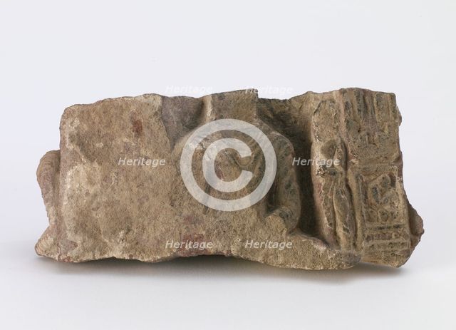 Fragment, showing torso of seated Buddha..., Period of Division, ca. 500. Creator: Unknown.
