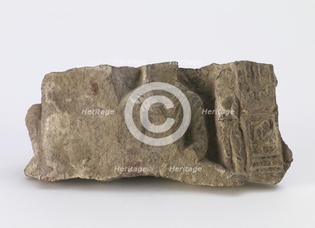 Fragment, showing torso of seated Buddha..., Period of Division, ca. 500. Creator: Unknown.