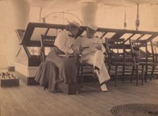 Frances B. Johnston and Admiral Dewey on the deck of the U.S.S. Olympia, 1899. Creator: Unknown
