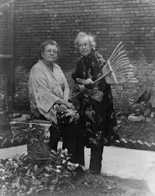 Frances B. Johnston in garden in New Orleans with "Pops" Whitesell, who is holding..., c1945 - 1952. Creator: Frances Benjamin Johnston