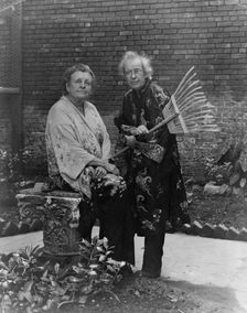 Frances B. Johnston in garden in New Orleans with "Pops" Whitesell, who is holding..., c1945 - 1952. Creator: Frances Benjamin Johnston