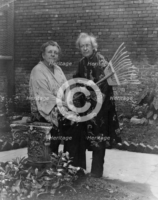 Frances B. Johnston in garden in New Orleans with "Pops" Whitesell, who is holding..., c1945 - 1952. Creator: Frances Benjamin Johnston.