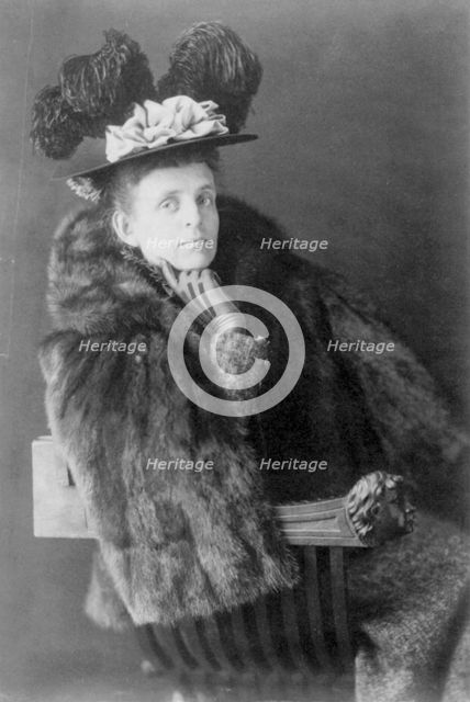 Frances Benjamin Johnston, 1864-1952, half length, seated, facing right, wearing fur jack..., 1890s. Creator: Frances Benjamin Johnston.