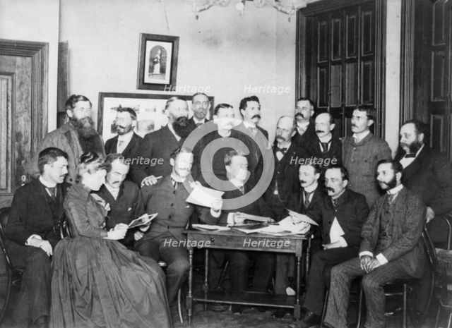 Frances Benjamin Johnston and Washington Camera Club looking at pictures, c1890. Creator: Frances Benjamin Johnston.