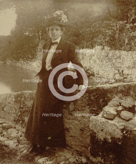 Frances Benjamin Johnston, full-length portrait, posing by a..., Cadenabbia, Lake Como, Italy, 1900. Creator: Unknown.