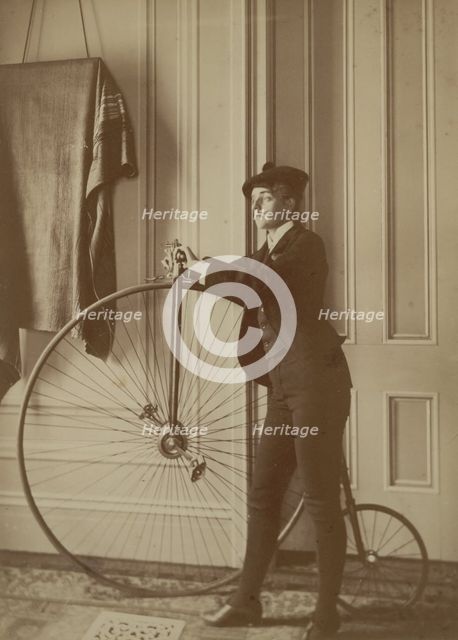 Frances Benjamin Johnston, full-length self-portrait dressed as a man with false..., c1890 - 1900. Creator: Frances Benjamin Johnston.