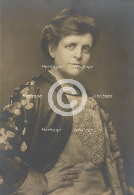 Frances Benjamin Johnston, half-length portrait, turned to the right, facing front, with..., 1911. Creator: William H Towles.