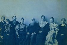 Frances Benjamin Johnston posed with seven members of her family, in her Washington..., 1896. Creator: Frances Benjamin Johnston