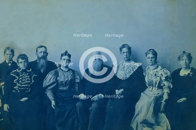 Frances Benjamin Johnston posed with seven members of her family, in her Washington..., 1896. Creator: Frances Benjamin Johnston.