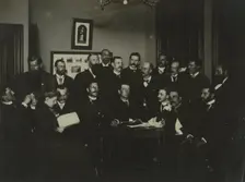 Frances Benjamin Johnston, seated in profile at left, group portrait with 18..., c1880 - 1900. Creator: Frances Benjamin Johnston