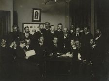 Frances Benjamin Johnston, seated in profile at left, group portrait with 18..., c1880 - 1900. Creator: Frances Benjamin Johnston
