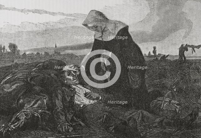 Franco-Prussian War (1870-71): Sisters of Charity on the battlefield, tending to the wounded, 1870.  Creator: Unknown.
