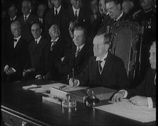 Frank Billings Kellogg Sitting Next to American President Calvin Coolidge Signing the Kellogg...1929 Creator: British Pathe Ltd