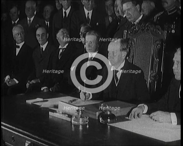 Frank Billings Kellogg Sitting Next to American President Calvin Coolidge Signing the Kellogg...1929 Creator: British Pathe Ltd.