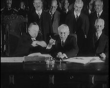 Frank Billings Kellogg Sitting Next to American President Calvin Coolidge Signing the Kellogg...1929 Creator: British Pathe Ltd