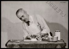 Frank Earl Holden Demonstrates Cutting into Mineral, January 18, 1951. Creator: United States National Museum Photographic Laboratory