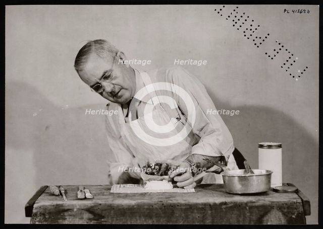 Frank Earl Holden Demonstrates Cutting into Mineral, January 18, 1951. Creator: United States National Museum Photographic Laboratory.