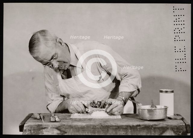 Frank Earl Holden Demonstrates Cutting into Mineral, January 18, 1951. Creator: United States National Museum Photographic Laboratory.