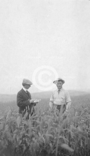 Frank G. Carpenter at an experimental farm, between c1900 and 1916. Creator: Unknown.