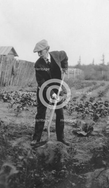 Frank G. Carpenter in a garden, between c1900 and 1916. Creator: Unknown.