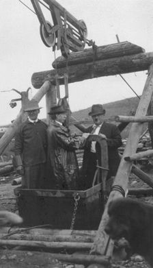 Frank G. Carpenter in middle of bucket at gold mine, between c1900 and 1916. Creator: Unknown