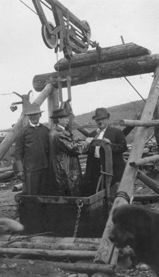 Frank G. Carpenter in middle of bucket at gold mine, between c1900 and 1916. Creator: Unknown