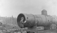 Frank G. Carpenter inspecting new railroad, between c1900 and 1916. Creator: Unknown
