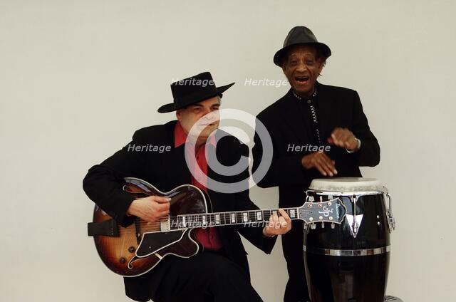 Frank Holder, Guyanan jazz singer and percussionist with Shane Hill, guitarist.   Artist: Brian O'Connor