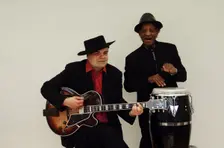 Frank Holder, Guyanan jazz singer and percussionist with Shane Hill, guitarist. Artist: Brian O'Connor