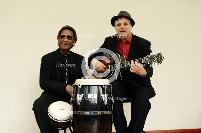 Frank Holder, Guyanan jazz singer and percussionist with Shane Hill, guitarist.   Artist: Brian O'Connor