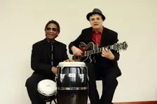 Frank Holder, Guyanan jazz singer and percussionist with Shane Hill, guitarist. Artist: Brian O'Connor