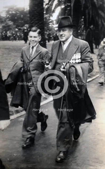 Frank Page with his son, Thomas. Creator: Unknown.