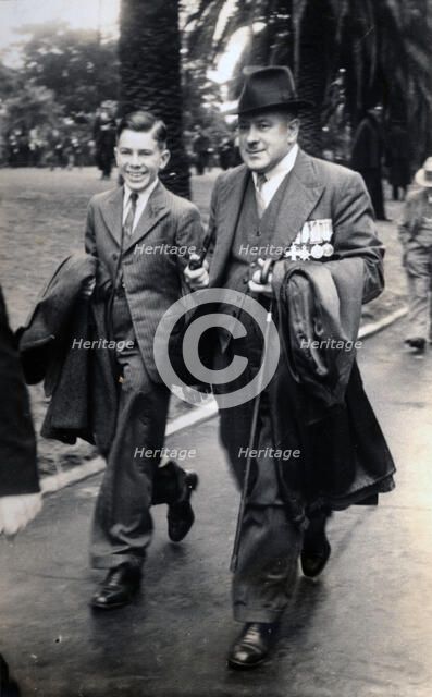 Frank Page with his son, Thomas. Creator: Unknown.