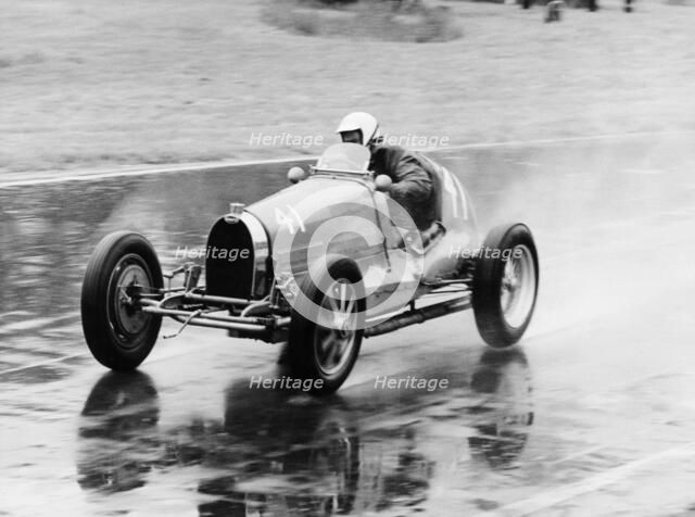 Frank Wall driving a Bugatti Type 35B, 1926. Artist: Unknown