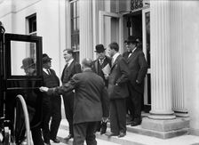 Franklin K. Lane, With Paper in Hand, in Crowd of Newsmen, 1914. Creator: Harris & Ewing