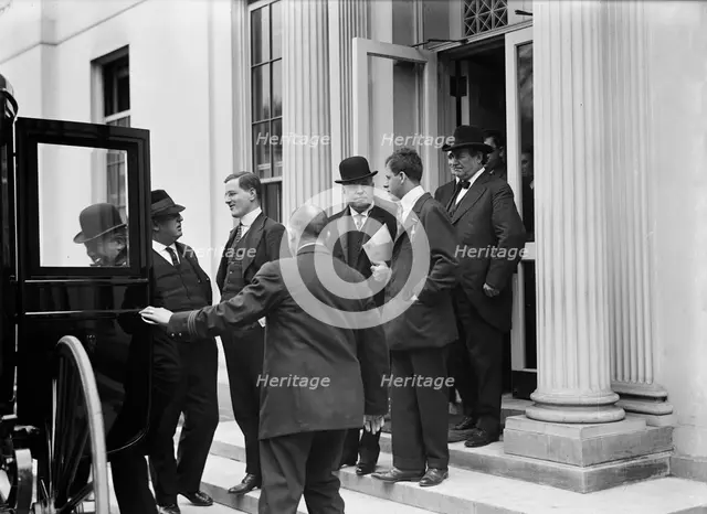 Franklin K. Lane, With Paper in Hand, in Crowd of Newsmen, 1914. Creator: Harris & Ewing.