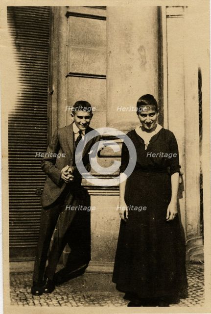 Franz Kafka with his sister Ottla before Oppelt House in Prague Artist: Anonymous  
