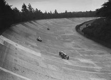 Frazer-Nash and Frazer-Nash BMW racing on the banking at Brooklands, 1938 or 1939. Artist: Bill Brunell