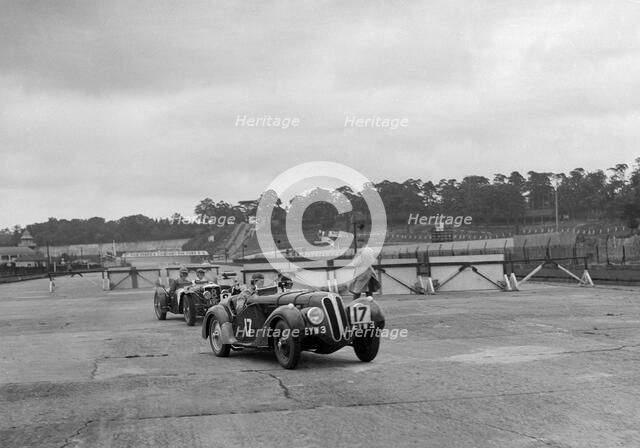 Frazer-Nash BMW 328 and Riley at the chicane, JCC Members Day, Brooklands, 1939. Artist: Bill Brunell.