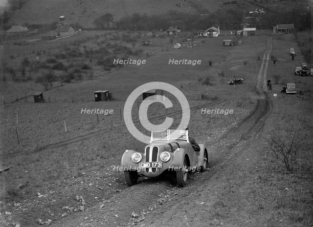 Frazer-Nash BMW 328 of H Wood at the London Motor Club Coventry Cup Trial, Knatts Hill, Kent, 1938. Artist: Bill Brunell.